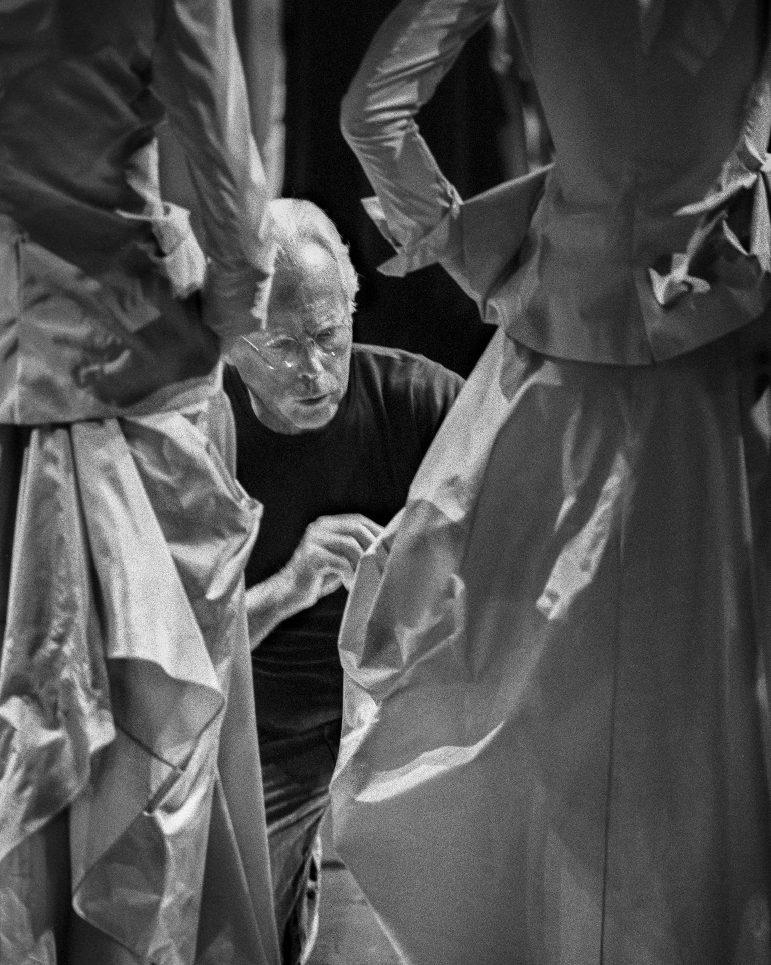 Giorgio Armani adjusting a dress