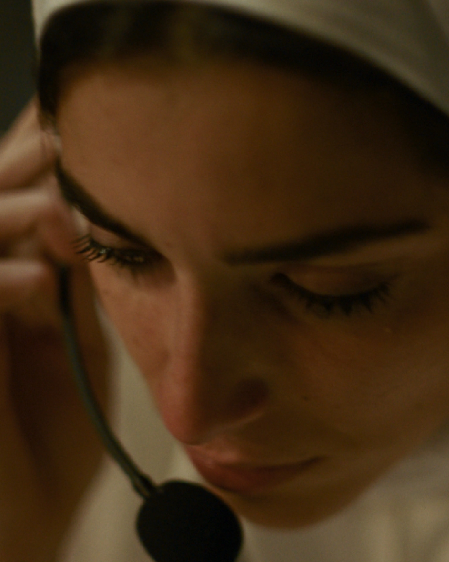 A woman speaking on a headset